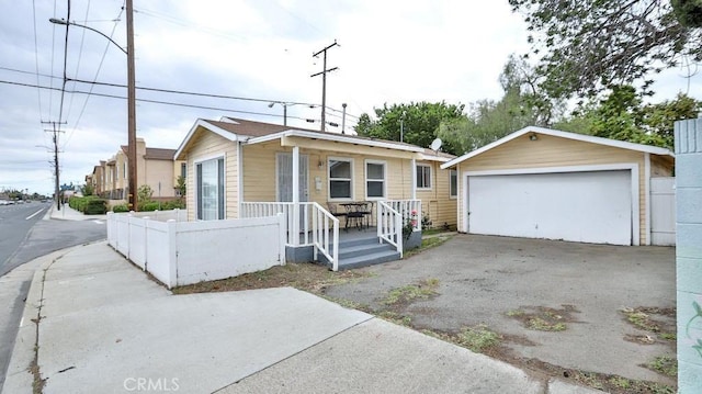 9051 Walker St, Cypress, CA 90630 - view of front of home featuring a garage and covered porch