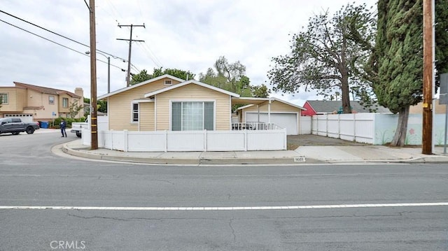 9051 Walker St, Cypress, CA 90630 - view of front of house featuring concrete driveway