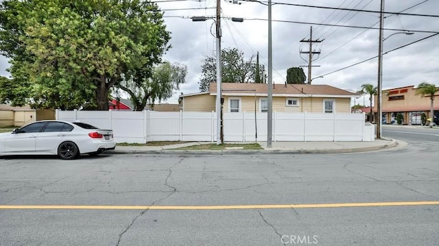 9051 Walker St, Cypress, CA 90630 - view of asphalt road with street lighting, curbs, and sidewalks