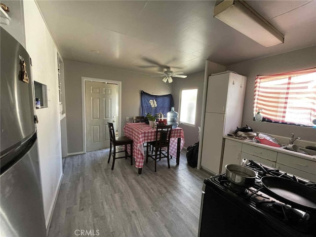 9051 Walker St, Cypress, CA 90630 - dining space featuring light wood finished floors and a ceiling fan