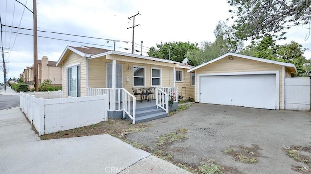 9051 Walker St, Cypress, CA 90630 - view of front of house featuring a garage and covered porch