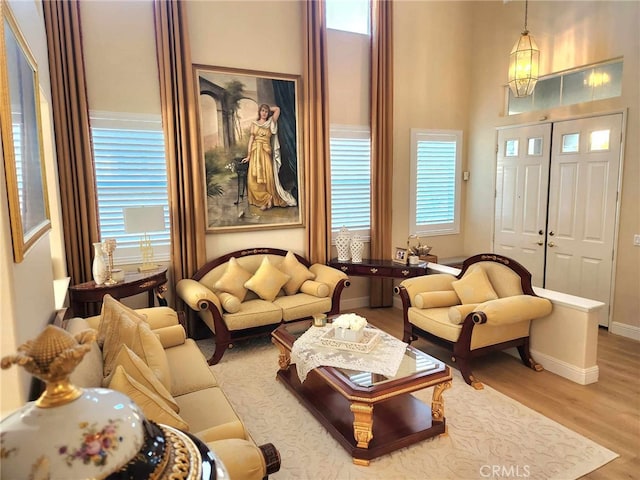 26523 Starling Ct, Canyon Country, CA 91387 - living area with wood finished floors and a high ceiling