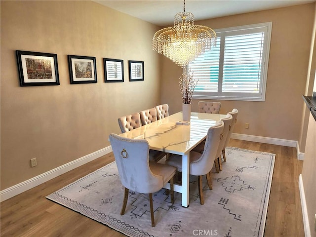 26523 Starling Ct, Canyon Country, CA 91387 - dining space with a chandelier and wood finished floors