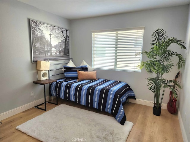 26523 Starling Ct, Canyon Country, CA 91387 - bedroom with wood finished floors and baseboards
