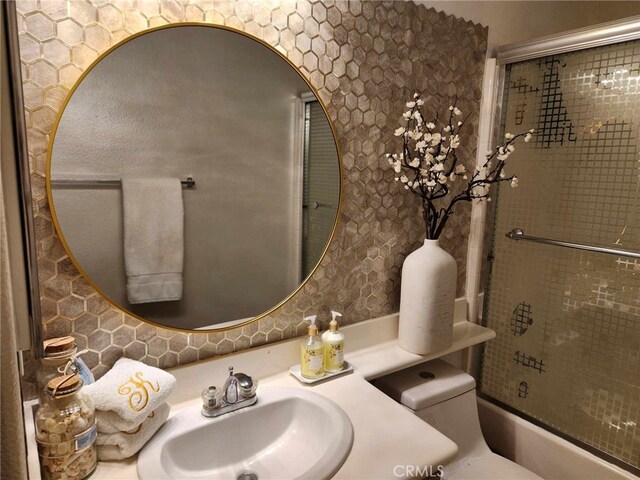 26523 Starling Ct, Canyon Country, CA 91387 - bathroom featuring shower / bath combination with glass door and vanity