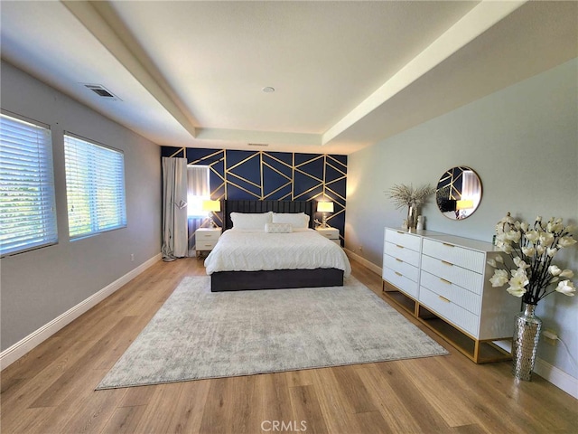 26523 Starling Ct, Canyon Country, CA 91387 - bedroom with a tray ceiling and wood finished floors
