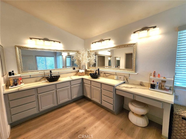 26523 Starling Ct, Canyon Country, CA 91387 - full bathroom featuring wood finished floors, vaulted ceiling, and double vanity