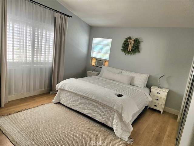 26523 Starling Ct, Canyon Country, CA 91387 - bedroom with wood finished floors and cooling unit