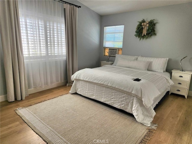 26523 Starling Ct, Canyon Country, CA 91387 - bedroom with wood finished floors and cooling unit