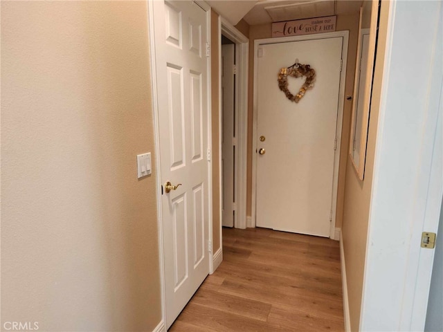 26523 Starling Ct, Canyon Country, CA 91387 - corridor with light wood finished floors and baseboards
