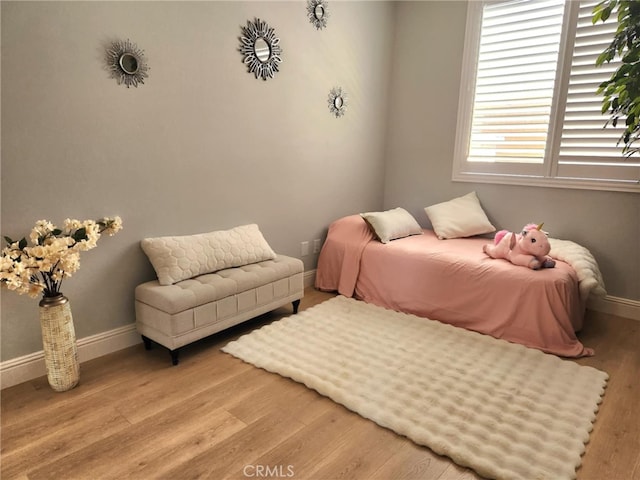 26523 Starling Ct, Canyon Country, CA 91387 - bedroom with baseboards and wood finished floors