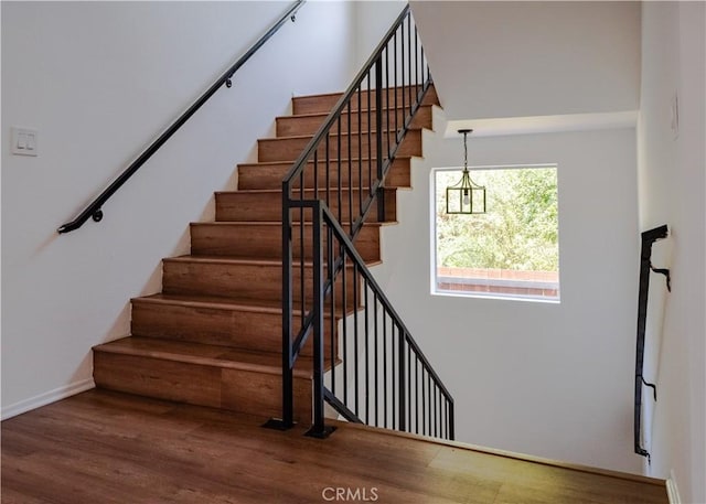 1522 N Benton Way, Los Angeles, CA 90026 - stairway with wood finished floors and baseboards
