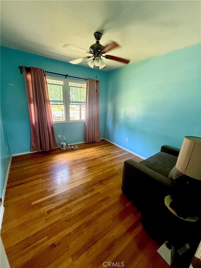 8514 Hickory Ln, Riverside, CA 92504 - living room featuring wood finished floors and a ceiling fan