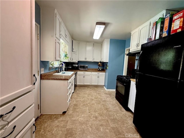 8514 Hickory Ln, Riverside, CA 92504 - kitchen featuring black appliances, white cabinets, under cabinet range hood, and stone finish floors