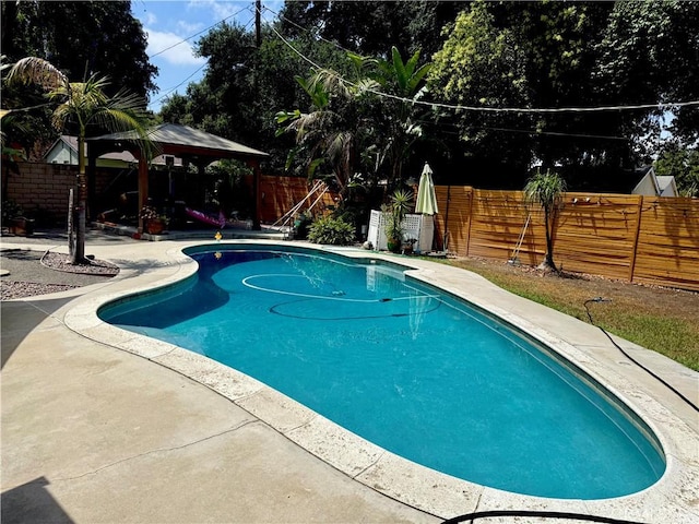 8514 Hickory Ln, Riverside, CA 92504 - view of pool featuring a gazebo, a fenced backyard, and a patio