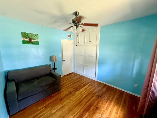 8514 Hickory Ln, Riverside, CA 92504 - sitting room featuring a ceiling fan and wood finished floors