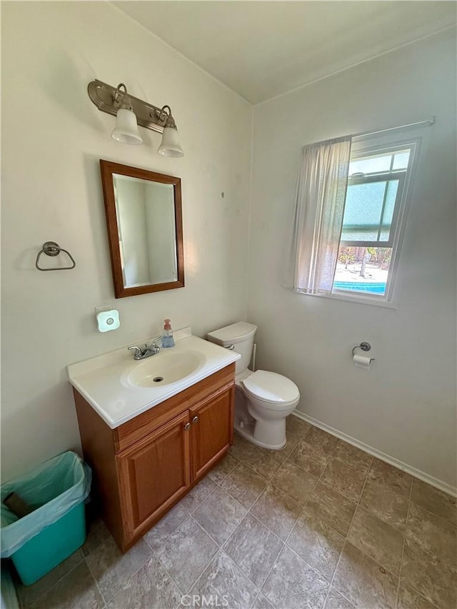 8514 Hickory Ln, Riverside, CA 92504 - half bath featuring vanity and toilet