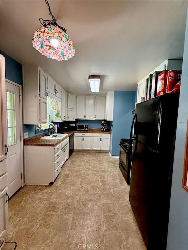 8514 Hickory Ln, Riverside, CA 92504 - kitchen with black appliances, dark countertops, and white cabinetry