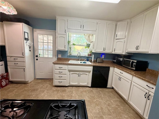 8514 Hickory Ln, Riverside, CA 92504 - kitchen with stainless steel microwave, dishwasher, and white cabinetry