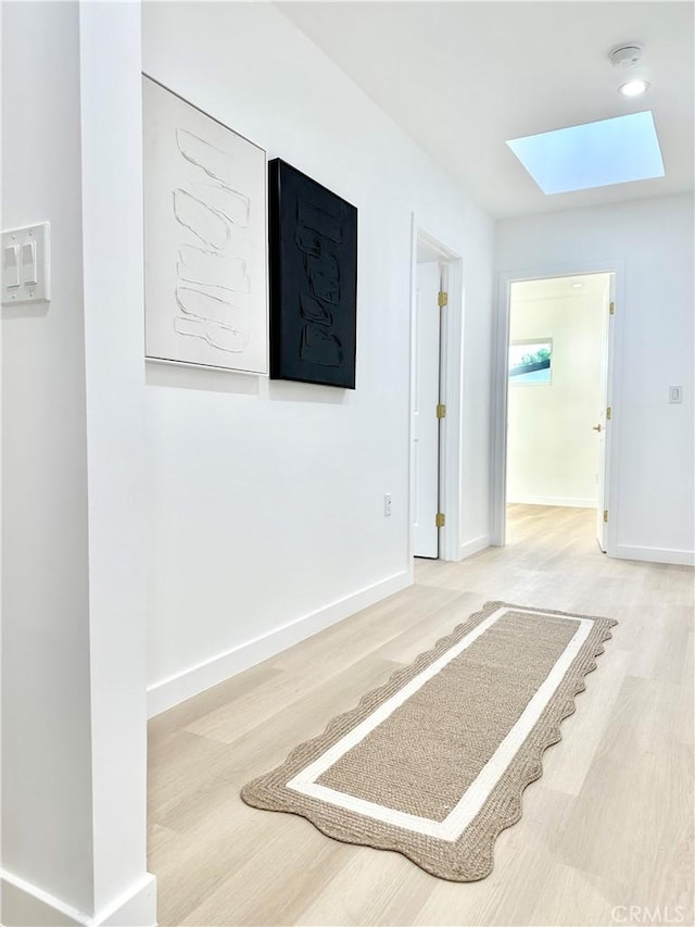 10335 Babbitt Ave, Granada Hills, CA 91344 - hall featuring a skylight and wood finished floors