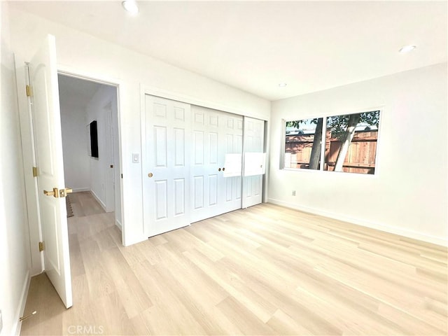 10335 Babbitt Ave, Granada Hills, CA 91344 - unfurnished bedroom featuring light wood finished floors, a closet, and recessed lighting
