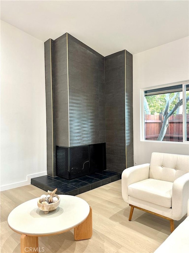 10335 Babbitt Ave, Granada Hills, CA 91344 - living area featuring wood finished floors and a fireplace