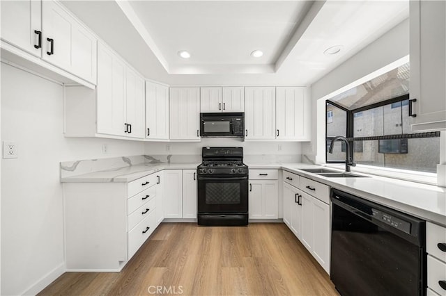 5510 Las Virgenes Rd, Calabasas, CA 91302 - kitchen featuring black appliances, light wood-style floors, white cabinetry, and recessed lighting