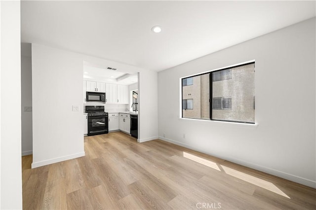 5510 Las Virgenes Rd, Calabasas, CA 91302 - unfurnished living room with light wood-style flooring and recessed lighting