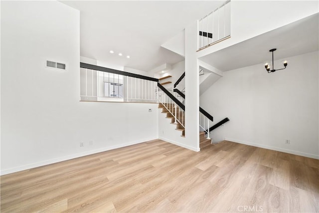 5510 Las Virgenes Rd, Calabasas, CA 91302 - stairway featuring wood finished floors and a chandelier