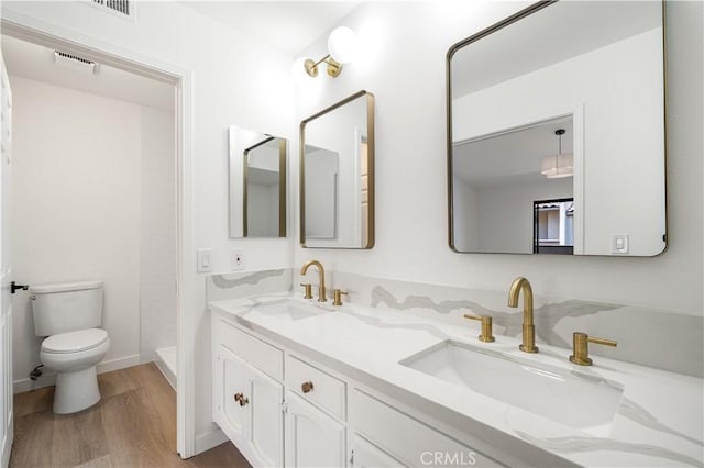 5510 Las Virgenes Rd, Calabasas, CA 91302 - full bath with wood finished floors, double vanity, and a tile shower
