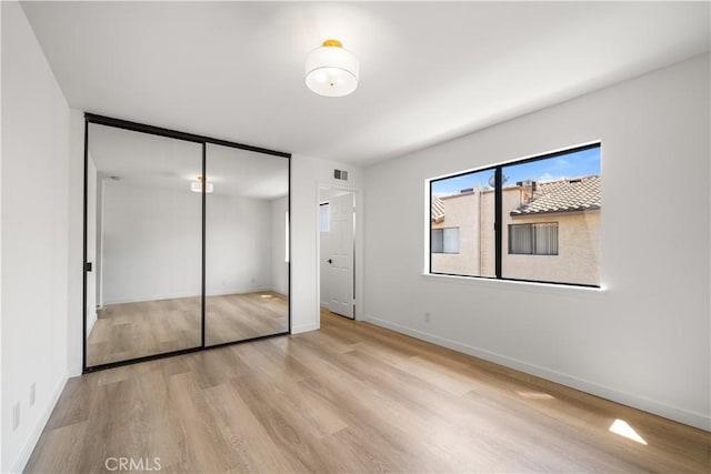 5510 Las Virgenes Rd, Calabasas, CA 91302 - unfurnished bedroom with wood finished floors and a closet