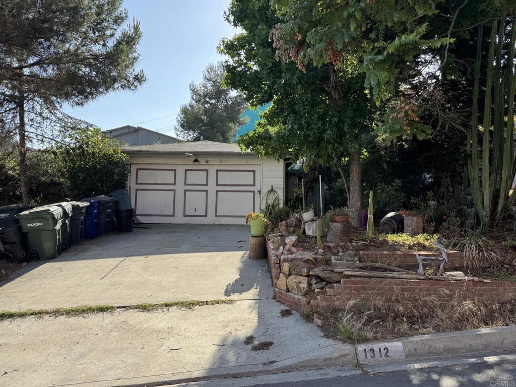 1312 Portola Ave, Spring Valley, CA 91977 - view of front of home featuring an outbuilding and a garage