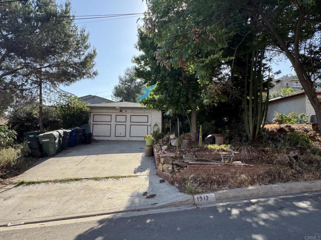 1312 Portola Ave, Spring Valley, CA 91977 - view of front of home with a garage and driveway