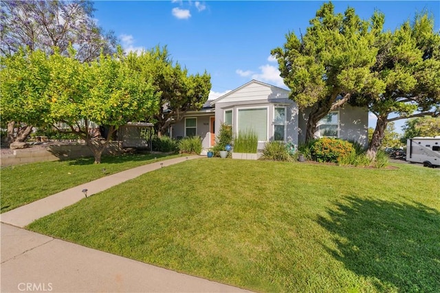15018 Mankato St, Mission Hills San Fernando, CA 91345 - view of front of home featuring a front lawn and stucco siding