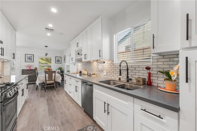 15018 Mankato St, Mission Hills San Fernando, CA 91345 - kitchen featuring dishwasher, range with gas stovetop, healthy amount of natural light, white cabinetry, and recessed lighting