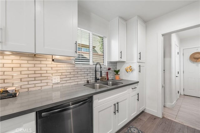 15018 Mankato St, Mission Hills San Fernando, CA 91345 - kitchen with stainless steel dishwasher, white cabinetry, dark countertops, and decorative backsplash