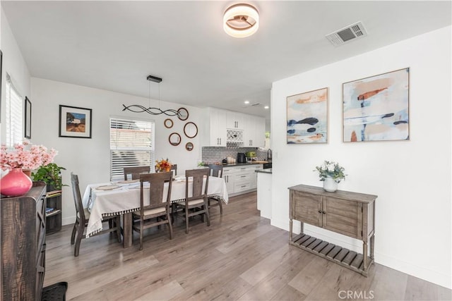 15018 Mankato St, Mission Hills San Fernando, CA 91345 - dining area with light wood-style flooring and recessed lighting