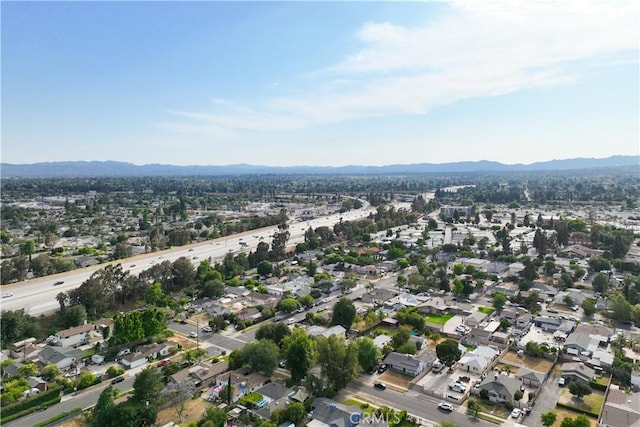 15018 Mankato St, Mission Hills San Fernando, CA 91345 - aerial overview of property's location with a mountain backdrop and nearby suburban area