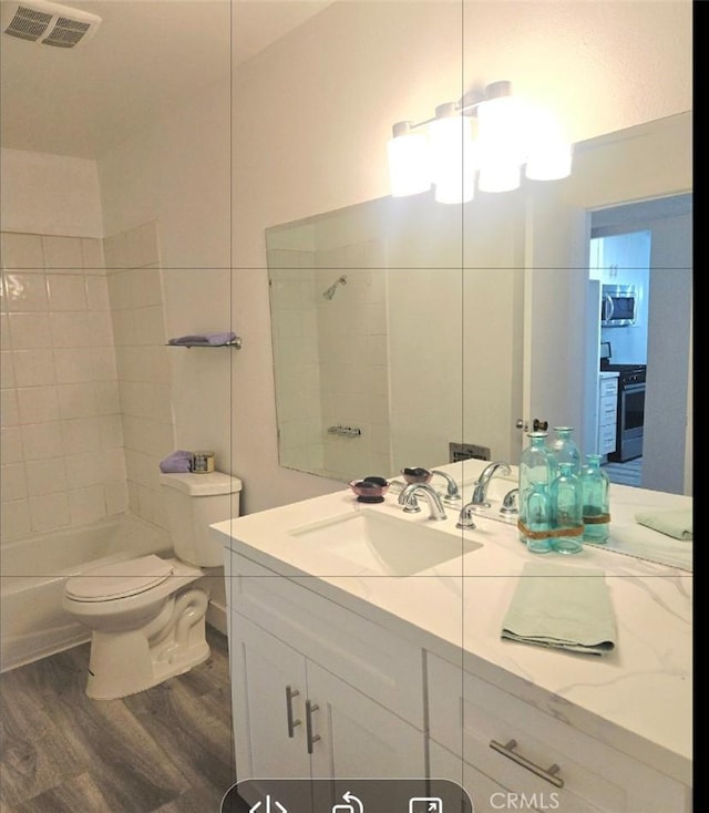 21000 Parthenia St Unit 6, Canoga Park, CA 91304 - full bathroom featuring wood finished floors, vanity, a chandelier, and bathtub / shower combination