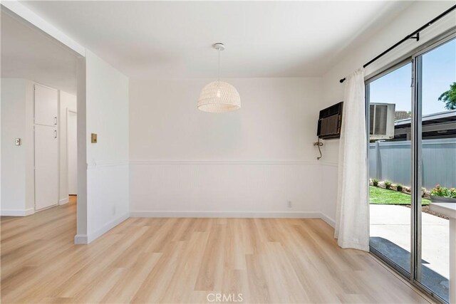 10 Eastmont, Irvine, CA 92604 - unfurnished dining area featuring light wood finished floors and a wall mounted AC