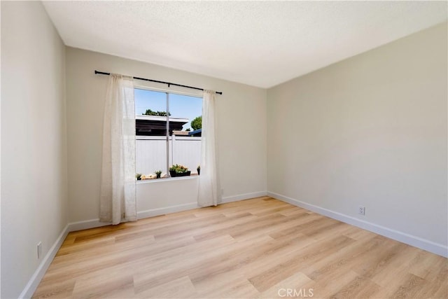 10 Eastmont, Irvine, CA 92604 - empty room featuring wood finished floors and baseboards