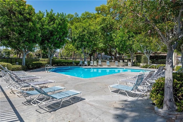 10 Eastmont, Irvine, CA 92604 - community pool featuring a patio area and view of wooded area