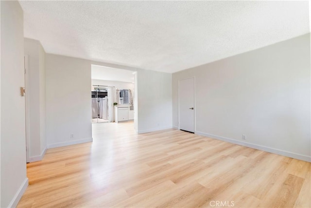 10 Eastmont, Irvine, CA 92604 - spare room with light wood-type flooring and a textured ceiling