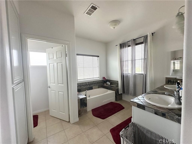 1539 Carmel Ct, Redlands, CA 92374 - bathroom featuring healthy amount of natural light, double vanity, a bath, and tile patterned flooring
