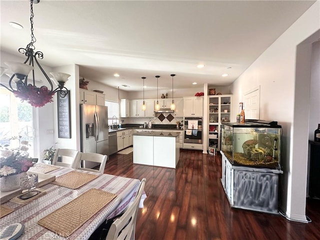 1539 Carmel Ct, Redlands, CA 92374 - dining space with a chandelier, dark wood-style flooring, and recessed lighting