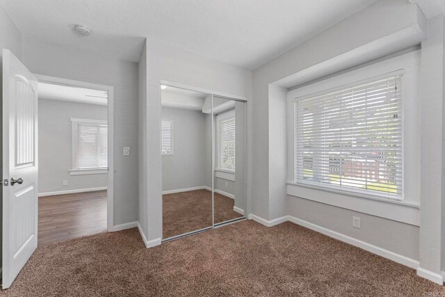 4117 Jamul Ave, San Diego, CA 92113 - unfurnished bedroom featuring carpet, a closet, and multiple windows