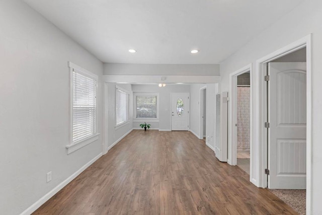 4117 Jamul Ave, San Diego, CA 92113 - unfurnished living room featuring wood finished floors, a heating unit, and recessed lighting