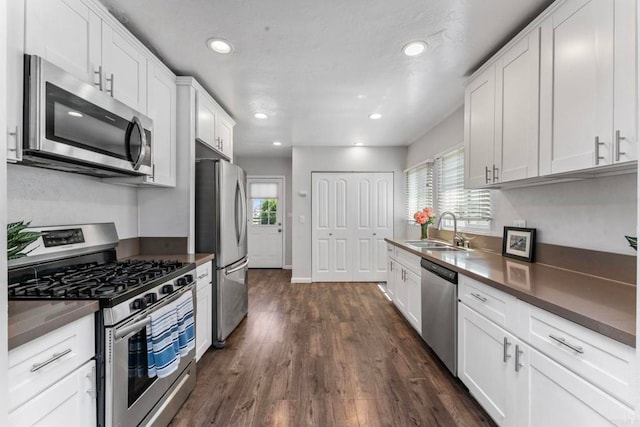 4117 Jamul Ave, San Diego, CA 92113 - kitchen featuring stainless steel appliances, plenty of natural light, dark countertops, and recessed lighting