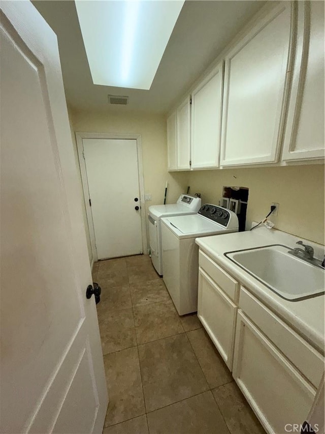 22241 Birchleaf, Mission Viejo, CA 92692 - washroom with cabinet space, independent washer and dryer, and light tile patterned floors