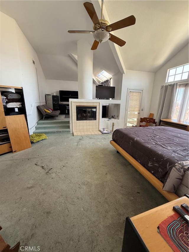 22241 Birchleaf, Mission Viejo, CA 92692 - carpeted bedroom with lofted ceiling, a tiled fireplace, and a ceiling fan
